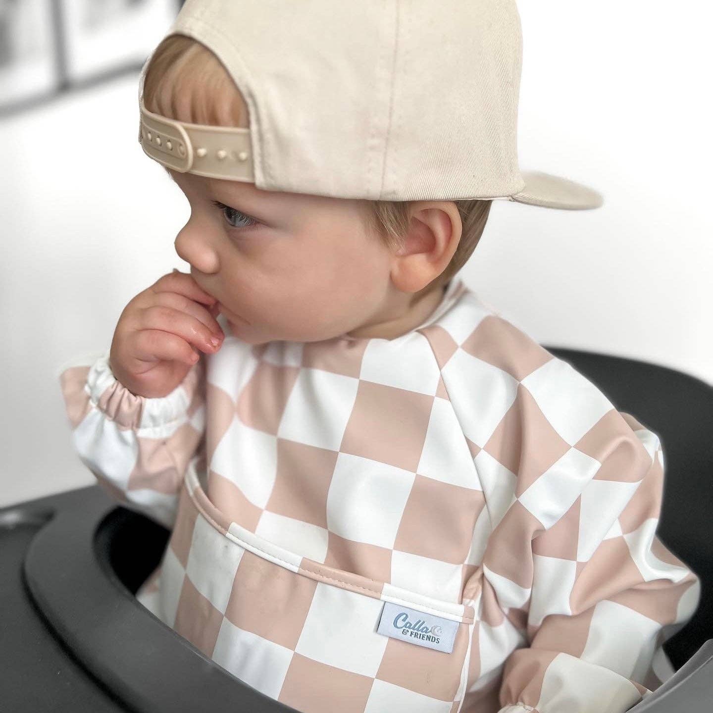 Grayson Long Sleeve Bib - Checkered - Petal Pink Baby Accessories Calla & Friends